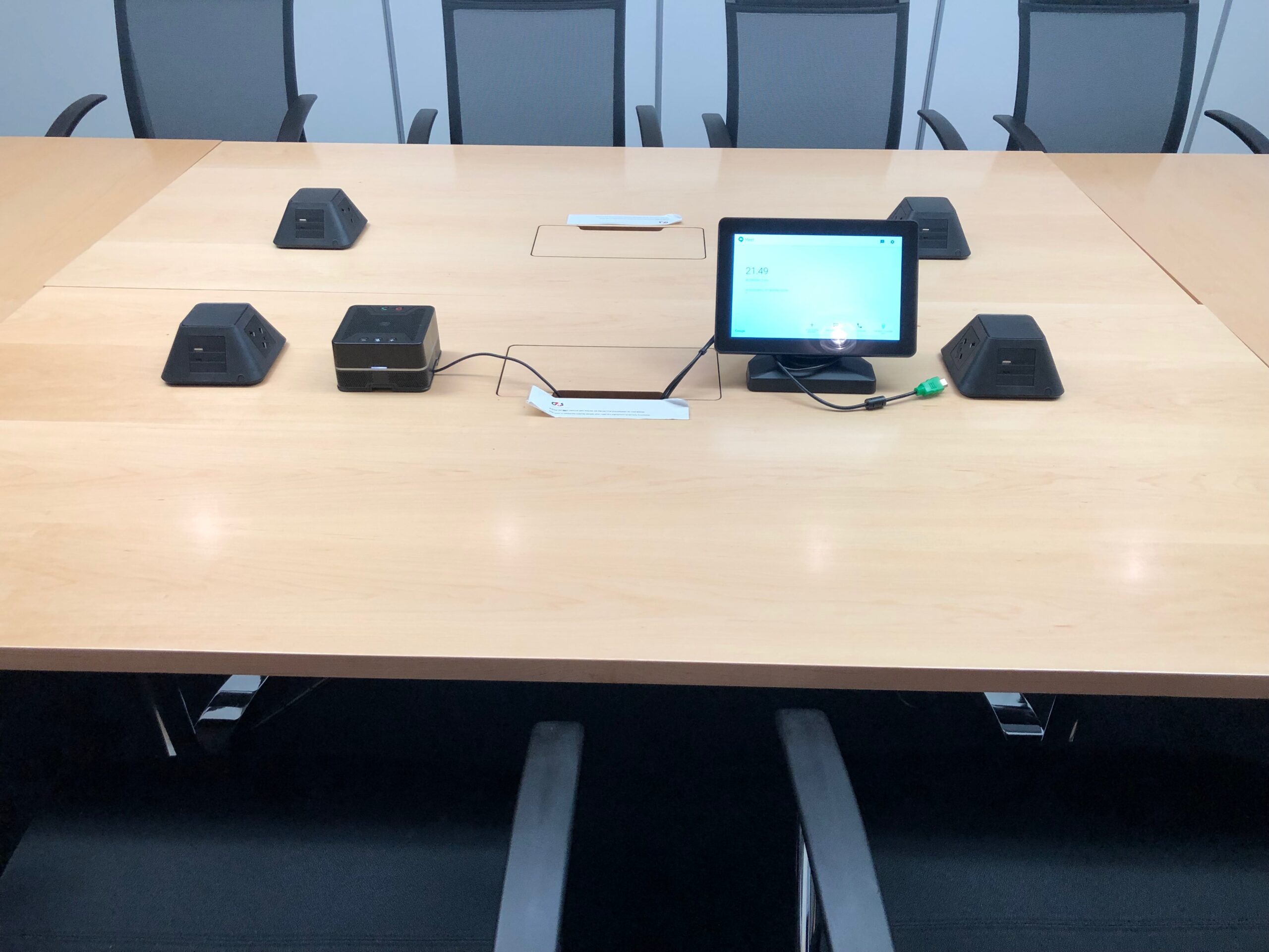 Desk close up with conferencing system